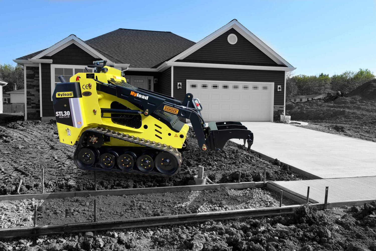 New Home Sidewalk and Driveway Construction with GCM Agencies Backhoe loader