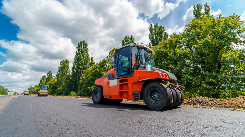Road repair, roller flattening new asphalt with Multi Tyre Roller